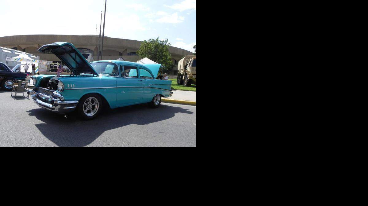 
Robert Ogden scored a prime parking place in front of Century II to show off his medium blue '57 Chevy 210 2-door sedan on the opening day of the 3-day show. 
