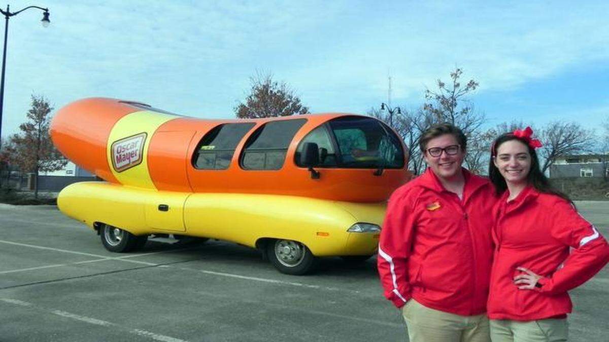 
Jessica Smith and Matt Heng have the happy responsibility of touring the country in one of six Oscar Mayer Wienermobiles. Each team of two drivers spends a full year motoring around in a 27-foot long, 7-ton hot dog on wheels, before turning the keys over to another team.
