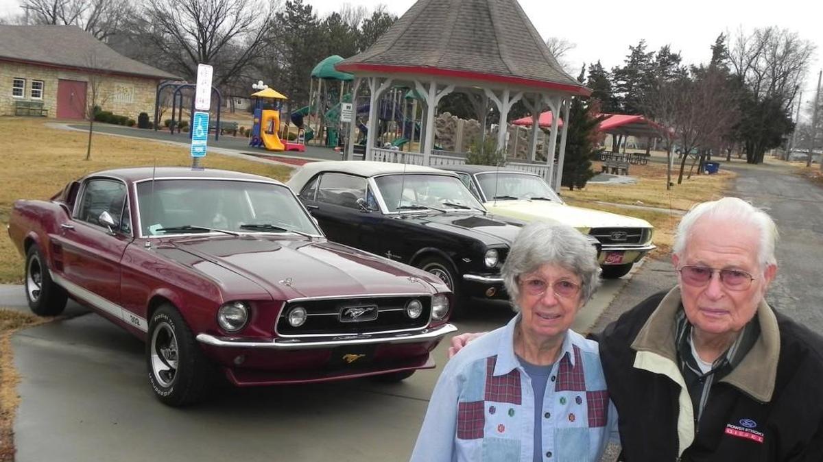 Raymond and Clara Lacey with their collection of vintage Mustangs. Approaching their 70th wedding anniversary, the Udall couple remain avid car showgoers.
