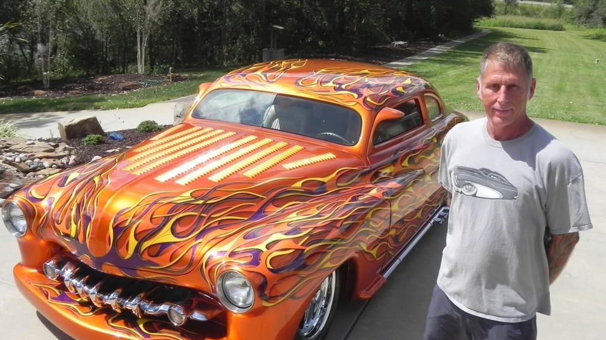 Tom Lough put the finishing touches on his family’s fabulous flamed 1950 Mercury, which his father, Larry Lough, bought some 35 years ago. He and his sister, Tammy Lough, show the car as a tribute to their dad, who customized the car three times before he passed away.