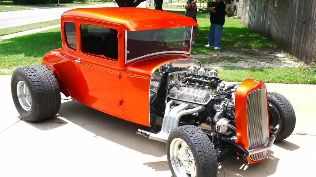 When Vernon Bishop decided his 1931 Ford 5-window coupe needed an updated paint job, his wife, Chris, told him to “pick an eye-catcher.” The House of Kolor Candy Tangerine met and surpassed that directive, with the color expertly applied by Jeff Ames. The unchopped body has been channeled a full 5 inches over the frame rails.