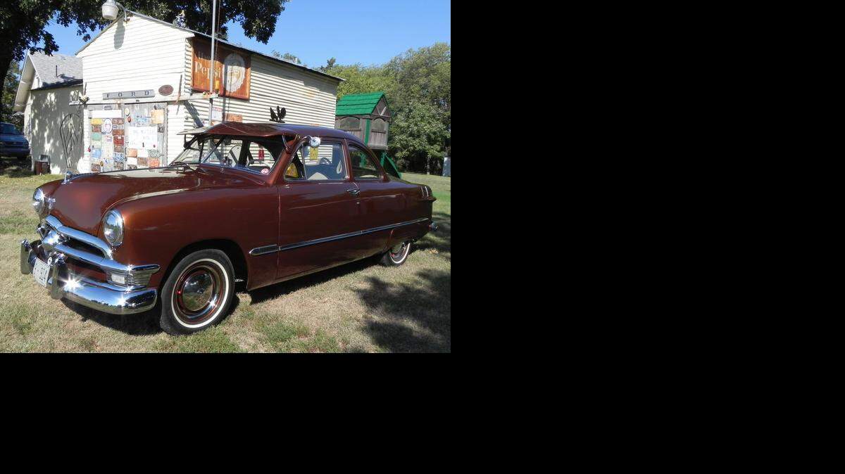 With the help of friends and family, David Moore transformed a tired old 1950 Ford Club Coupe into this stunning shoebox street rod. The car is mostly stock, but has plenty of nostalgic touches, such as curb feelers, Fulton sun visor and ribbed fender skirts.