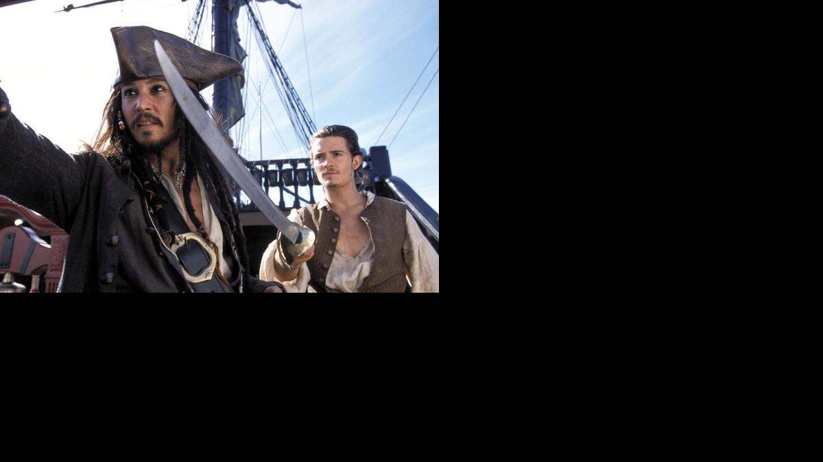 
Johnny Depp as Captain Jack Sparrow, left, and Orlando Bloom as Will Turner join forces in Walt Disney's "Pirates of the Caribbean: The Curse of the Black Pearl," in this undated publicity photo. 
