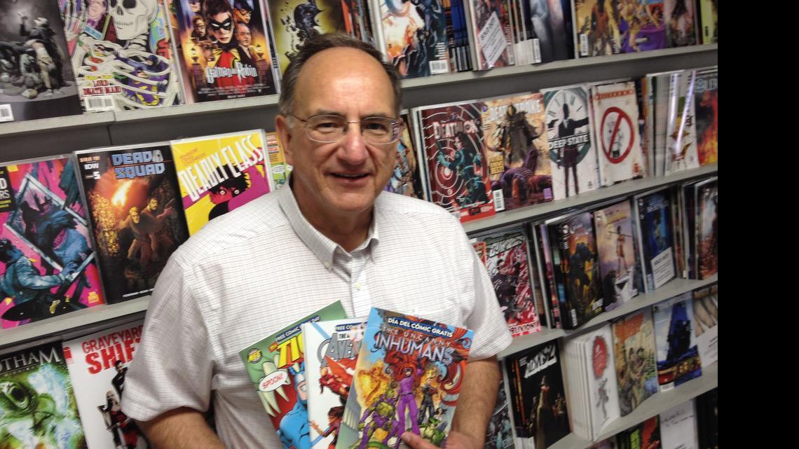 
Marc Brown, owner of Prairie Dog Comics, with some of the titles that will be given away as part of Free Comic Book Day on Saturday.
