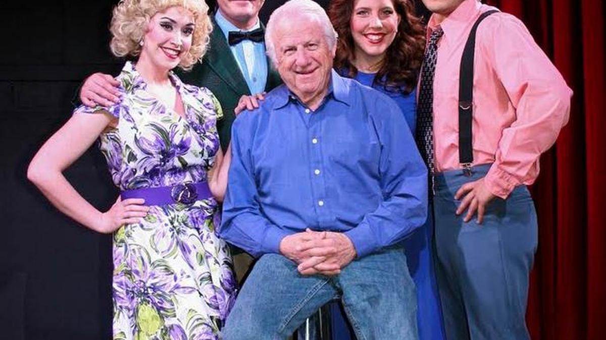 “Party of 1” celebrates the joys and perils of being single in America circa 1986. From left are performers Rhonda LaRue, Michael Karraker, Jennie Hughes and Damian Padilla. Seated is author Morris Bobrow.
