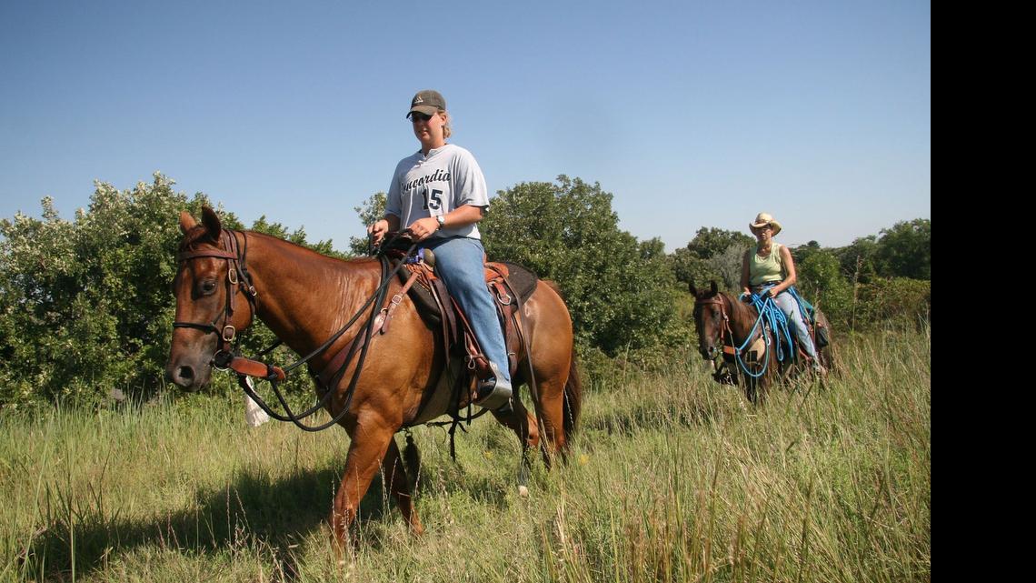 
Amity Bruns, Beaver Crossing, Neb., rides her horse, Zip, along one of Kanopolis State Park’s 26 miles of equestrian trails.
