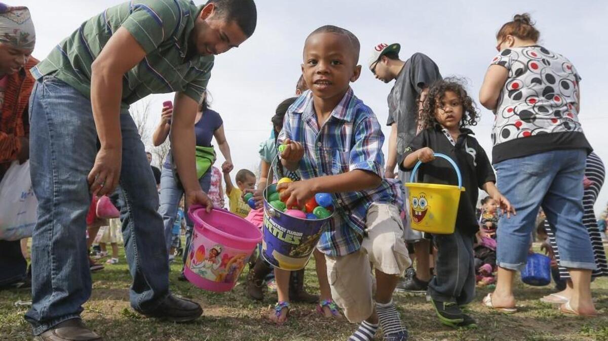 Tyler Green runs after more plastic Easter eggs during the city-sponsored egg hunt at O.J. Watson park on Saturday morning.