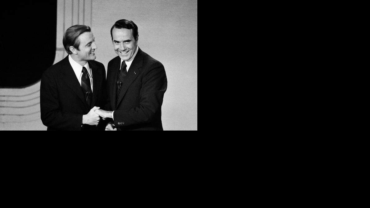 
Senator Walter Mondale, left, and Sen. Robert Dole shake hands before beginning the vice presidential debate Friday, Oct. 15, 1976, in Houston. 
