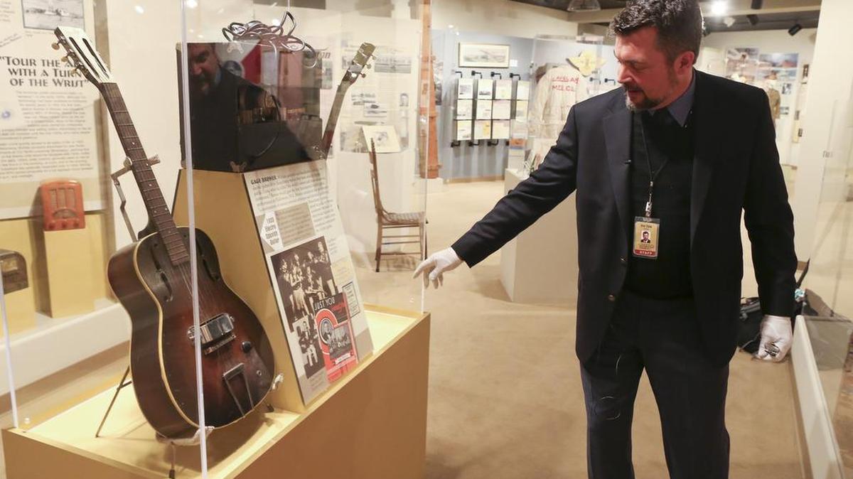 Eric Cale, director of the Wichita-Sedgwick County Historical Museum, talks about one of the earliest electric guitars. The guitar was owned by Wichita musician Gage Brewer.
