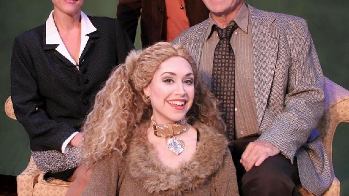 “Sylvia,” the story of a dog and the family who rescues it, opens at Roxy’s Downtown on Friday. Rhonda LaRue who plays the dog is seated on the floor. Other cast members are from left: Cindy Summers, Kevin Reese and Rob Summers.
