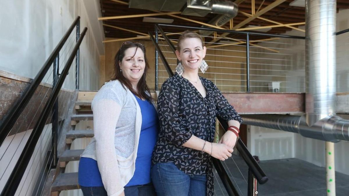 Harvester Arts COO Kristin Beal, left, and Kate Van Steenhuyse CEO and co-founder of Harvester Arts, in its space at 215 N. Washington.