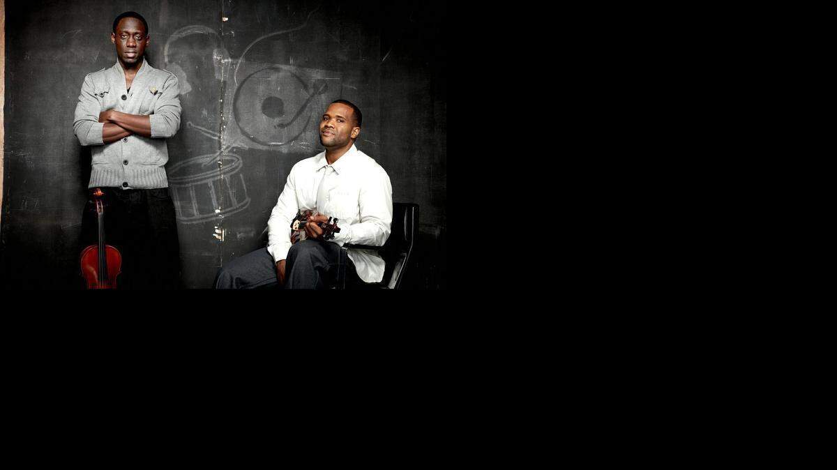 
Wil Baptiste, right, and Kevin Marcus make up Black Violin, an act that fuses classical music and hip-hop.
