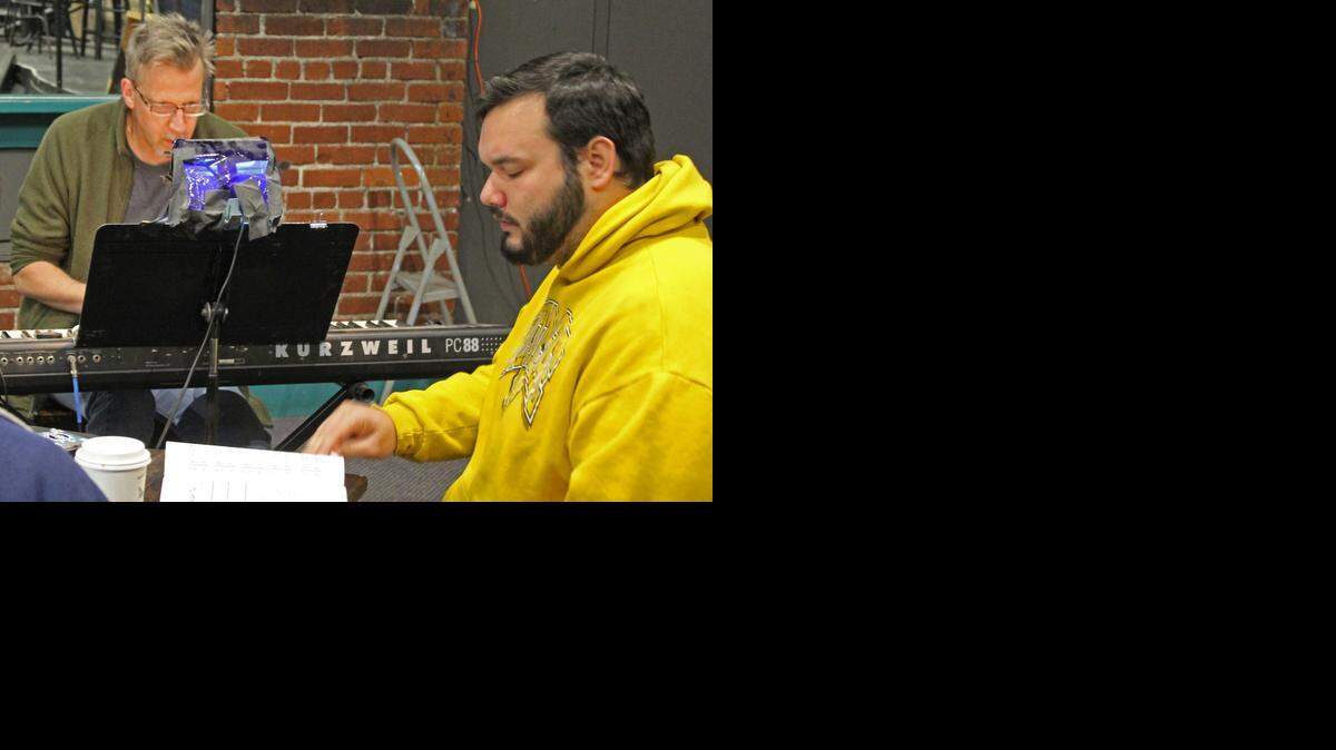 
Rich Bruhn, left, directs Ben Balleau in a rehearsal for “Plaid Tidings.”
