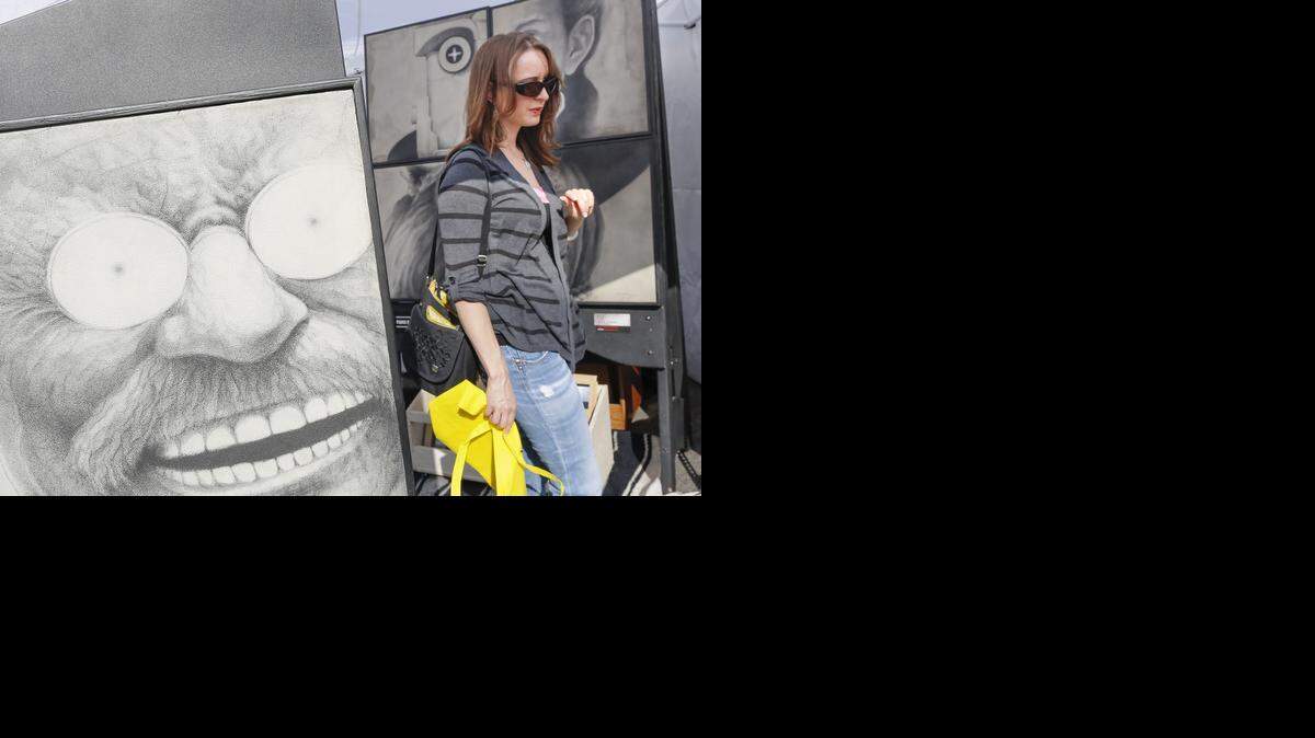 
Ale Levine checks out artwork at the 2013 Autumn and Art festival at Bradley Fair.
