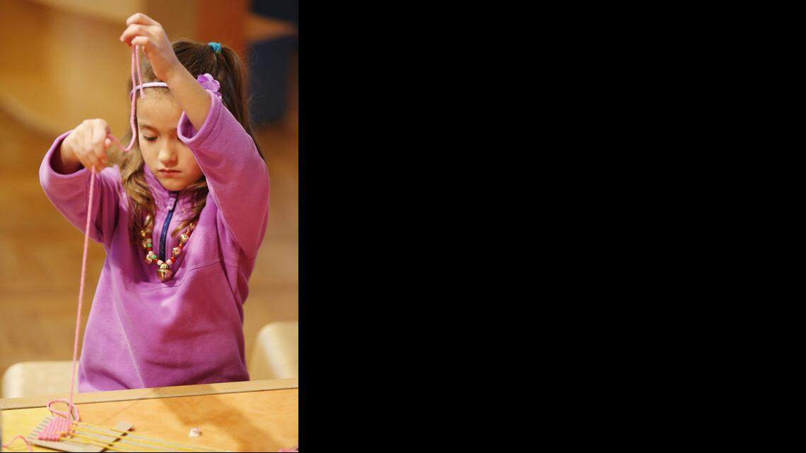 
Six-year-old Katelyn Strum works on an art project at Wichita Art Museum on Friday as part of Winter Art Mania. The free family event runs through Sunday. (December 26, 2014)
