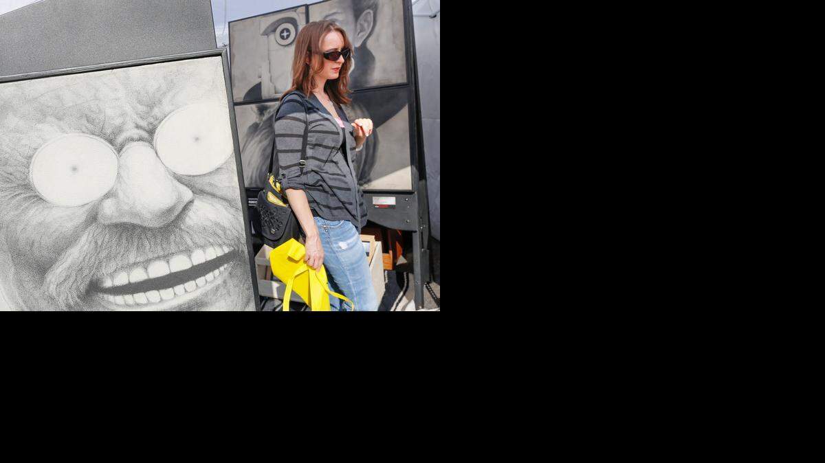
Ale Levine checks out artwork at the 2013 Autumn and Art festival at Bradley Fair.
