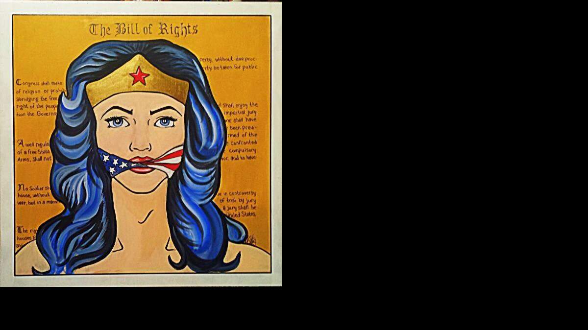 
Melissa Slate’s artwork depicts Wonder Woman gagged.
