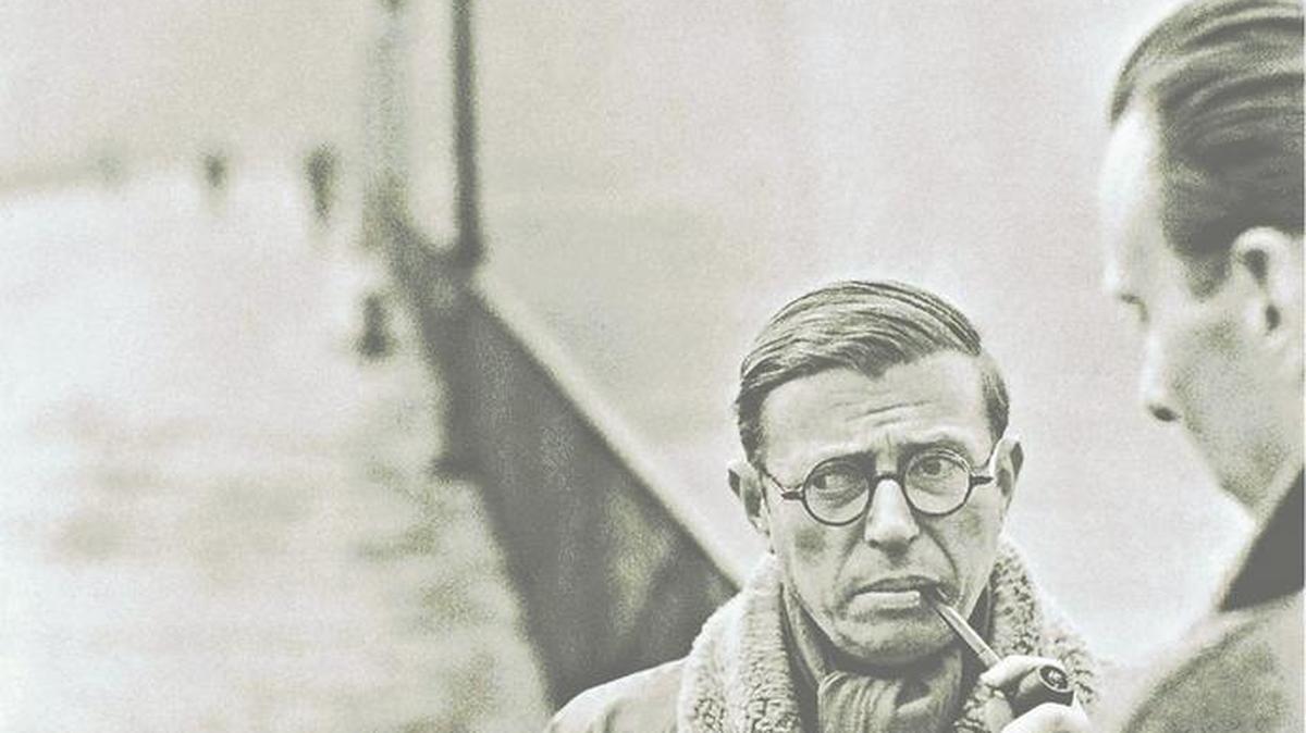 Jean-Paul Sartre, with his trademark pipe, founded French existentialism with classic works like “Nausea” and “Being and Nothingness.”