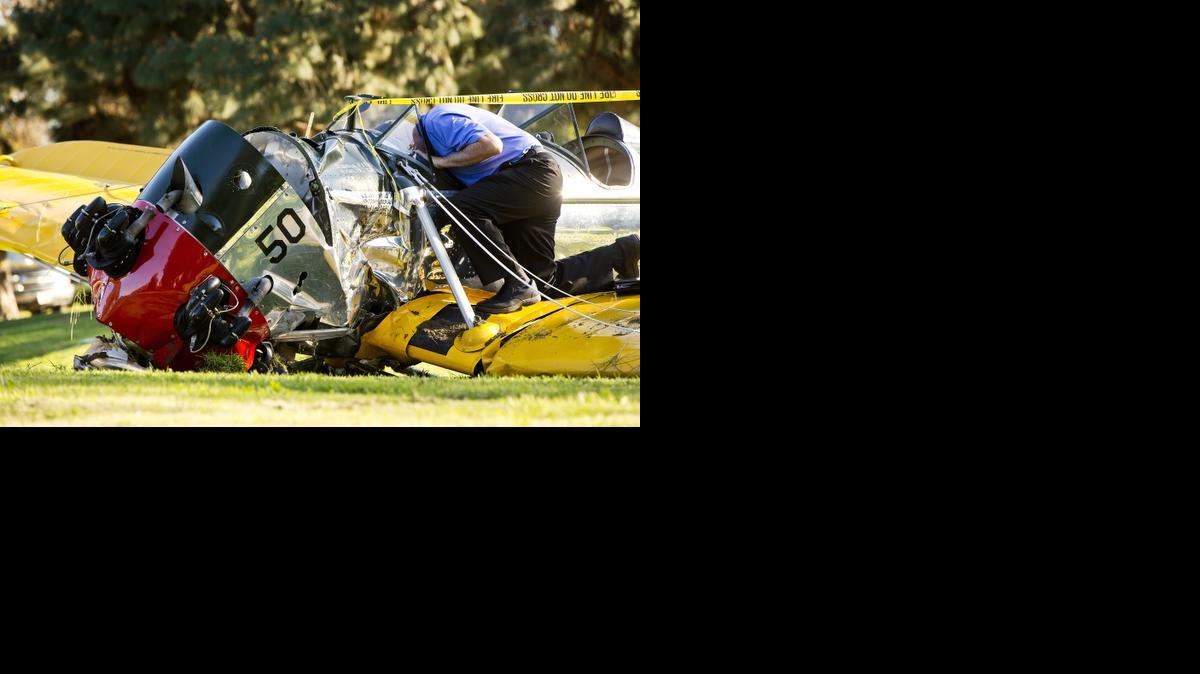 
An investigator works on the scene of a vintage airplane that crash-landed on the Penmar Golf Course in the Venice area of Los Angeles, Thursday, March 5, 2015. Harrison Ford crash-landed the airplane shortly after taking off from a nearby airport and reporting engine problems. 
