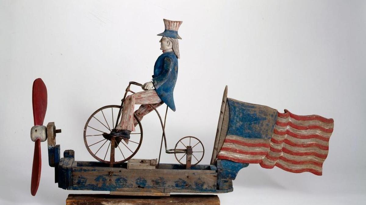 Uncle Sam Riding a Bicycle Whirligig is among the folk art on display at Crystal Bridges Museum of American Art in Bentonville, Ark.