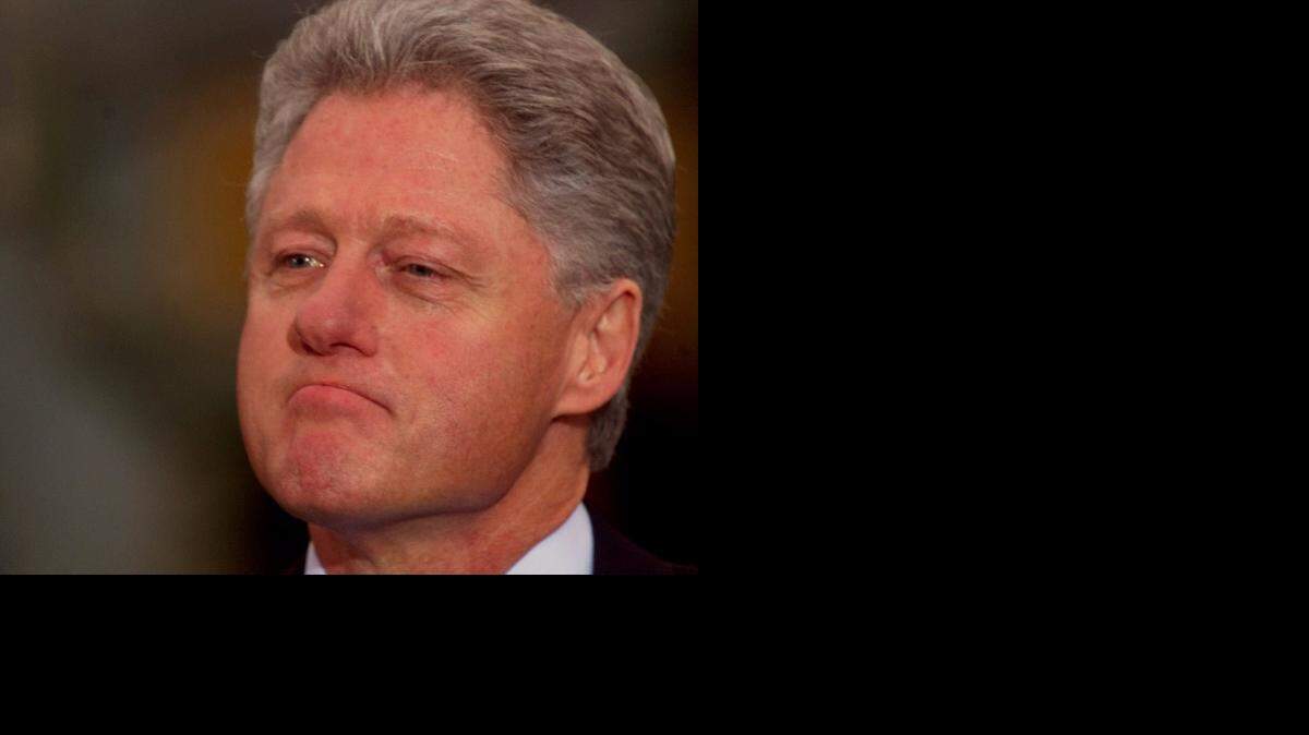 
President Bill Clinton looks on as Vice President Al Gore addressed members of Congress outside the Oval Office after the House of Representatives voted to impeach the president, Saturday Dec.19, 1998.
