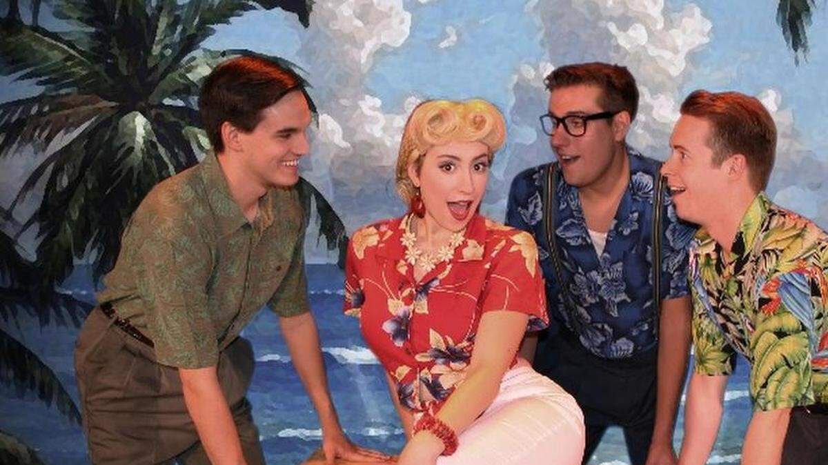 Three stagehands fill in for the missing Andrews Sisters during a UFO show in “Andrews Brothers” The show runs through Oct. 15 at Roxy’s Downtown. From left: Nicholas J. Reese, Madeleine White, Sam Warner and Ryan Schafer.
