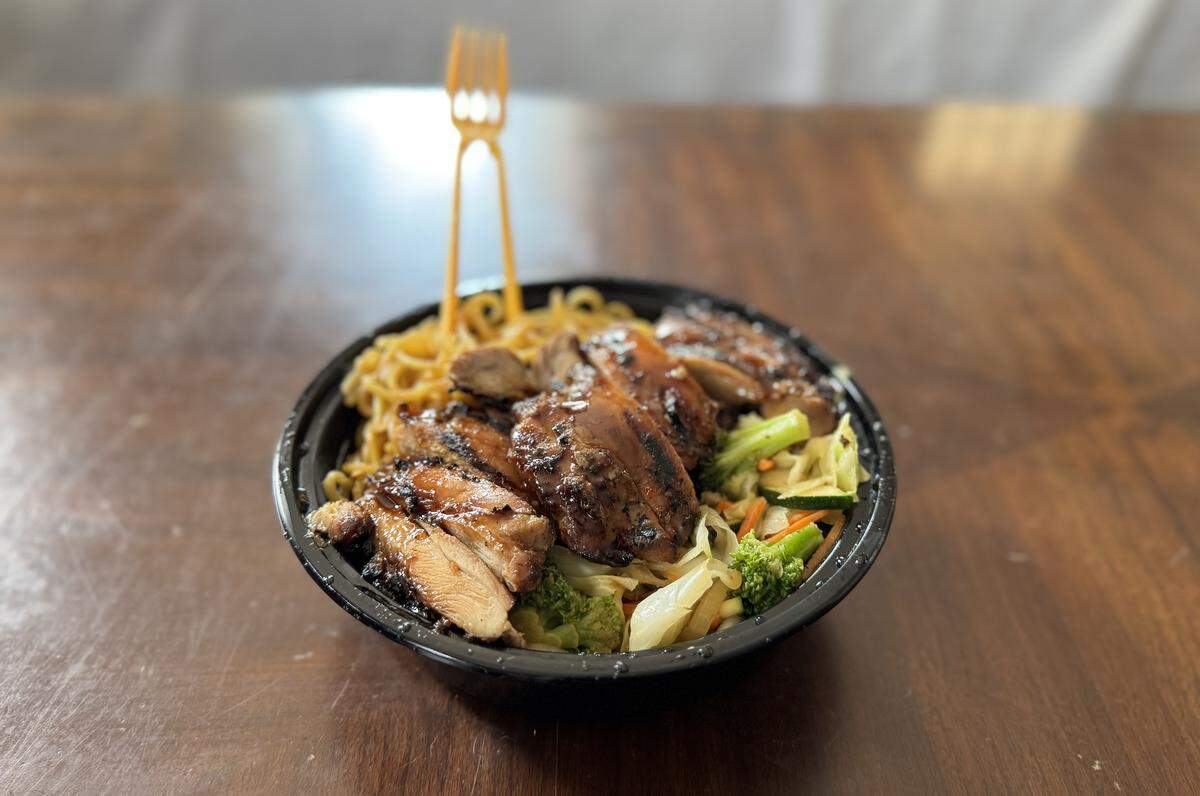 The bowls at the new Teriyaki Madness come in three sizes with a handy fork-meets-chopsticks contraption.