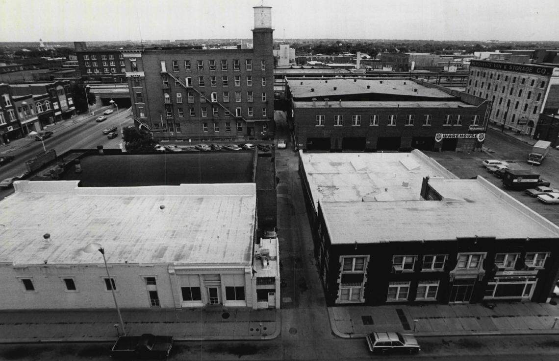 This Wichita Eagle photo from 1977 shows some of the buildings at Douglas and St. Francis before they were torn down to make way for Naftzger Memorial Park. The Victory Theater is the building with the dark roof in the bottom left section of the photo. 