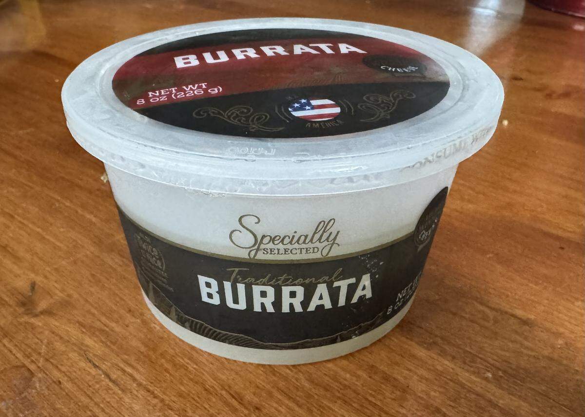 I recently found this container of two balls of burrata cheese at Aldi. It’s also available at Trader Joe’s and Whole Foods, and I sometimes find it at Dillons. Burrata cheese is like a ball of mozzarella with a creamy center.