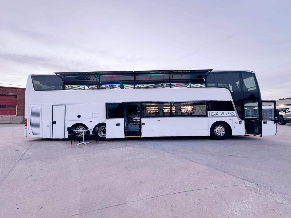 Shea West and Rochelle Collins spent six months transforming an old Van Hool coach bus that was previously used to haul visitors around Walt Disney World into a double-decker mobile bar.