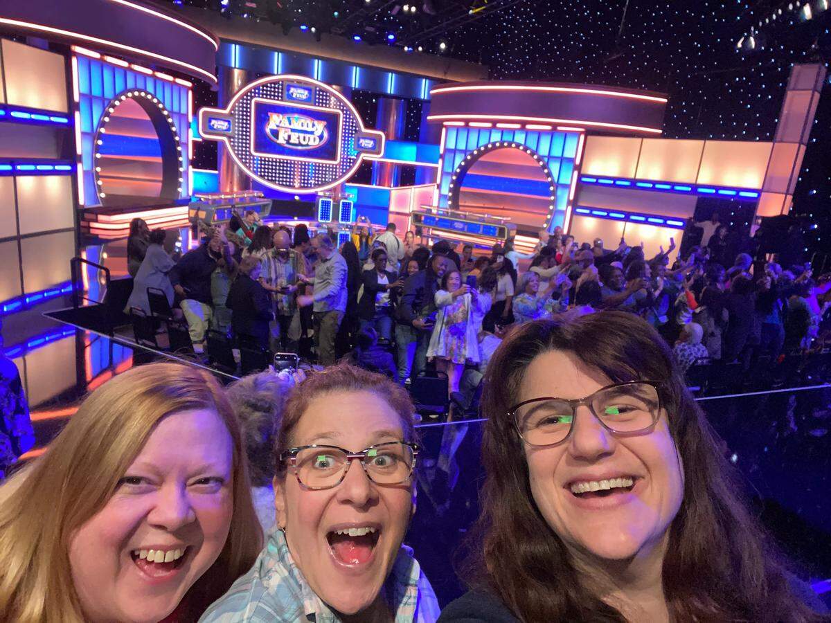 Carrie Rengers, left, Denise Neil and Jaime Green were in the audience when The Barber family of Wichita competed on “Family Feud.” The show featuring the Barbers airs on Friday.