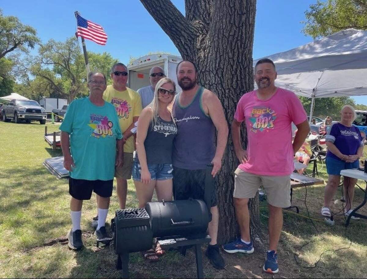 Quentin Seiler, second from left, is a competitive barbecue cook turned food truck owner who is about to open a stationary restaurant in Maize called Q’s Your Daddy BBQ & Catering.