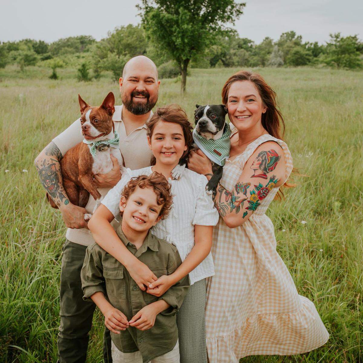 Chef Josh Rathbun is pictured with his family, which includes wife, Andrea, right; daughter Charlotte, 10, second from right; son Noah, 8, third from right; and Boston Terriers Teddy, left, and Sophie, right.