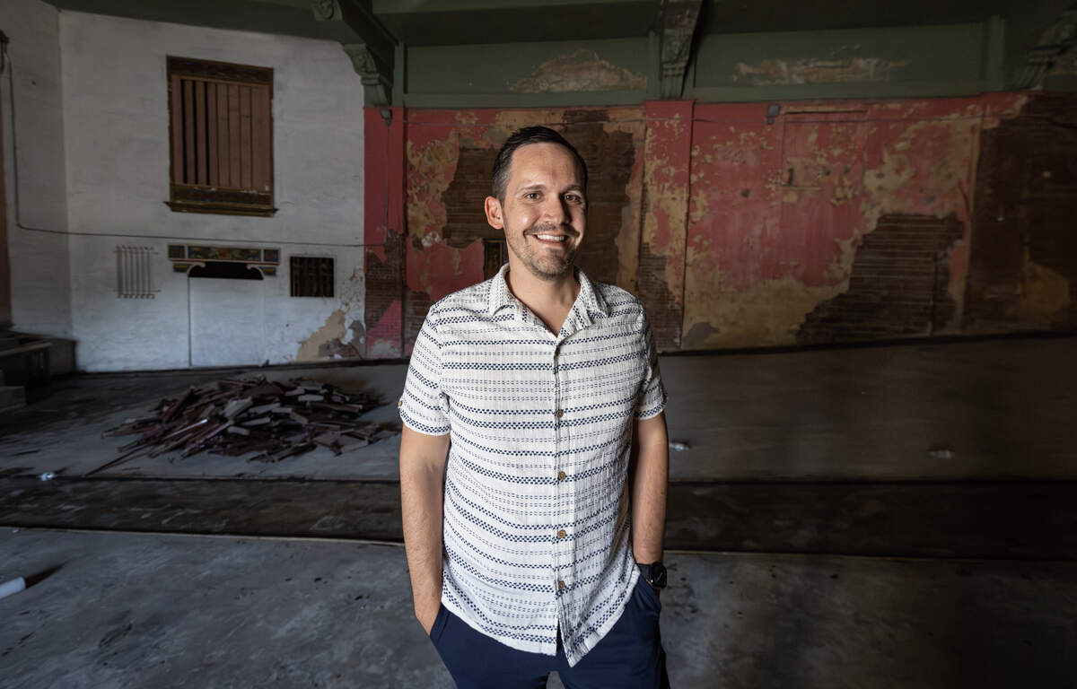 Ariel Rodriguez, the executive director of the nonprofit group Empower, is pictured inside the old Nomar Theater. Empower, which owns the 1929 building, plans to turn it into a food hall that will give food entrepreneurs a low-risk place to learn their business.