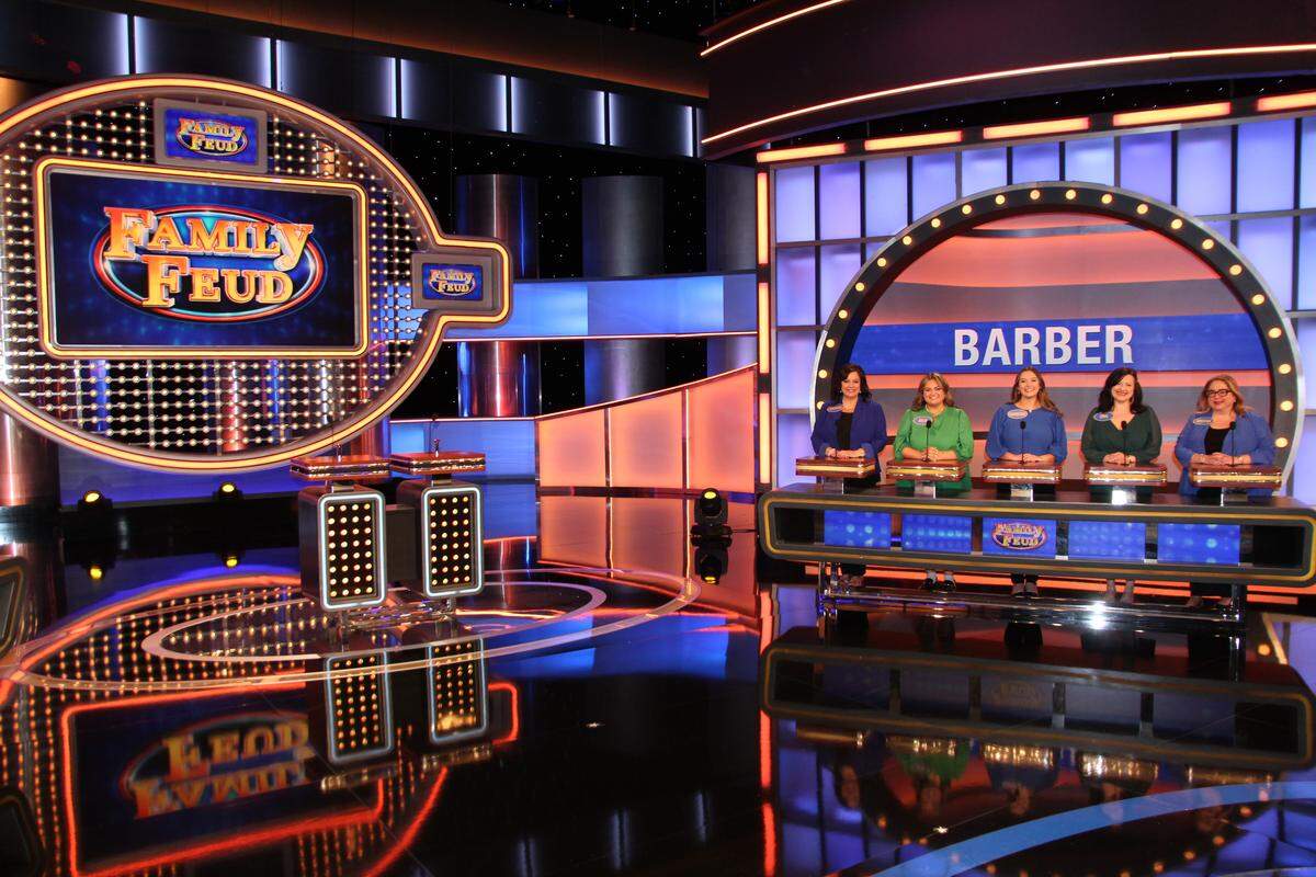 The Barber women pose for a photo on the set of “Family Feud,” which is filmed in Atlanta at Tyler Perry studios.