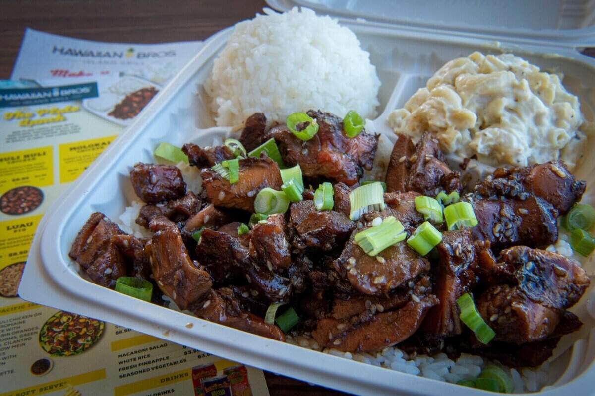 Honolulu Chicken at Hawaiian Bros. Island Grill is infused with garlic, green onions and sesame and served with macaroni salad and white rice.