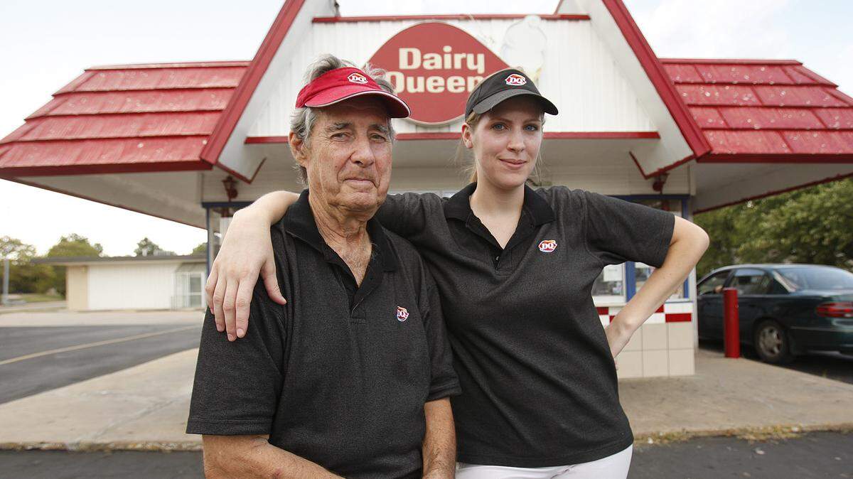 Former Dairy Queen owner Richard Barrett, left, is pictured in 2010 with his then store manager. Barrett, who owned the store at Lincoln and Grove from 1987 until 2022, died on Tuesday morning.