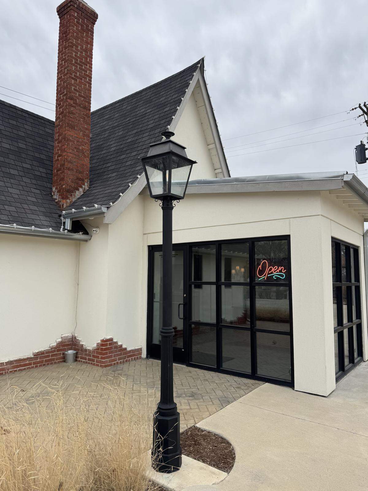 The owners of Wichita’s Goldfinch Coffee & Cocktails acquired two New Orleans gas lamps to decorate the exterior of their business.