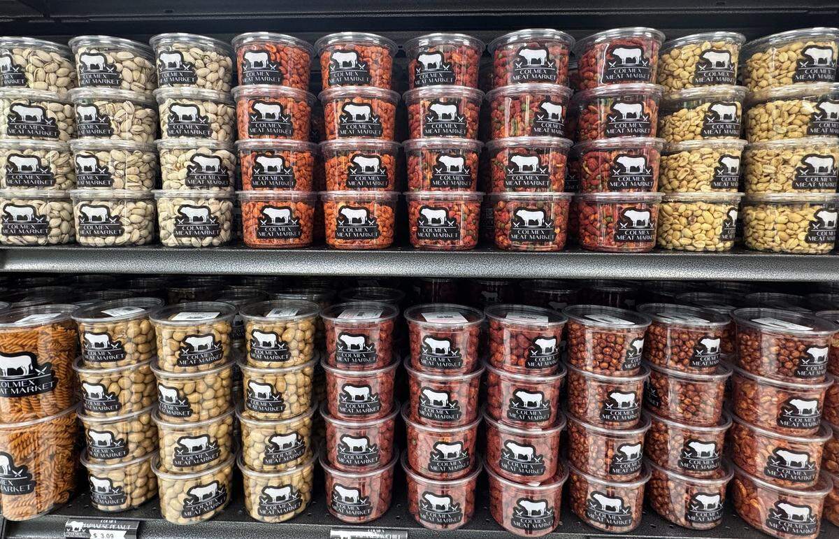 Colmex Meat Market has a section displaying containers of Mexican pasta, nuts, dry beans and more.