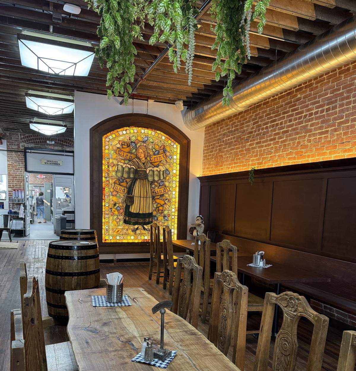 The “stammtisch,” or public table, from the original Prost now sits in the main dining room of the new space on St. Francis.