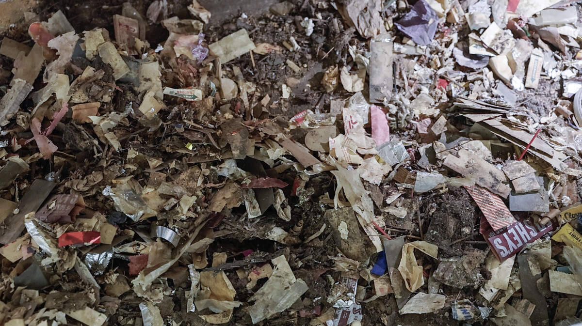 Work crews carefully sorted through piles of trash unearthed when they tore up the interior of The Orpheum Theatre.