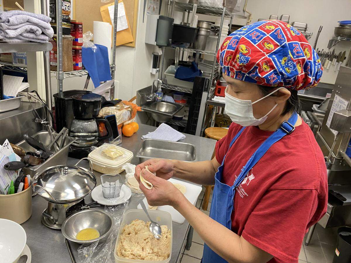 Yook Gan is pictured at her restaurant Asian Wok shortly after it opened in 2021. She died earlier this month at age 62.