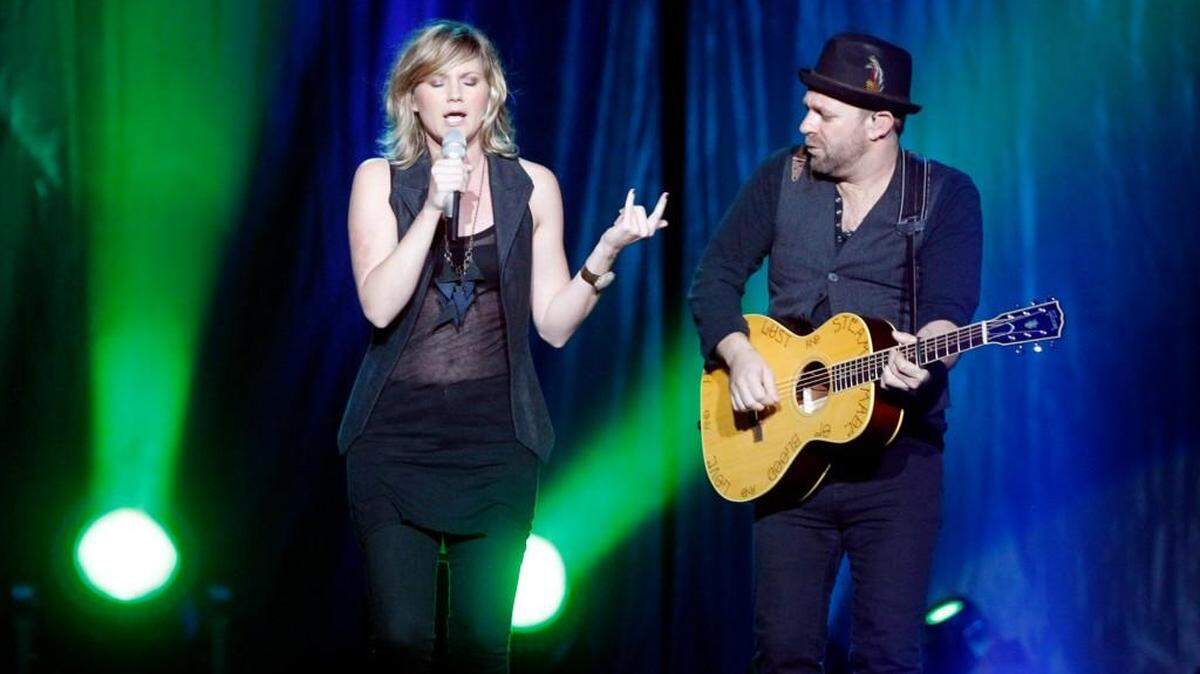 Country music duo Jennifer Nettles, left, and Kristian Bush of Sugarland perform for the crowd at the Intrust Bank Arena in 2011. The band is returning to the arena this weekend.