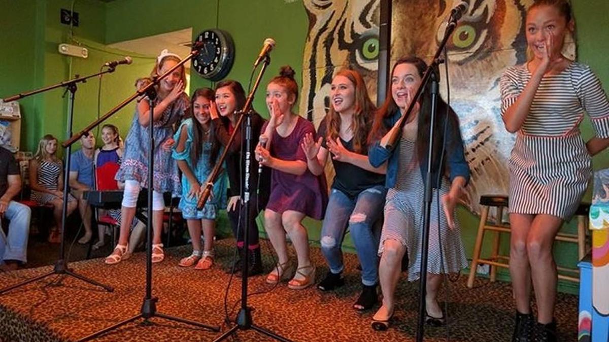 Singers with The Studio perform at a past cabaret at The Donut Whole.