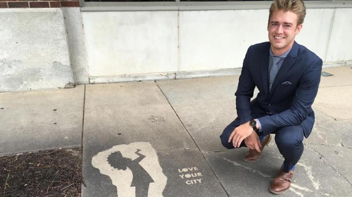 Alex Pemberton with an early Yellowbrick Street Team project to paint Wichita’s sidewalks.