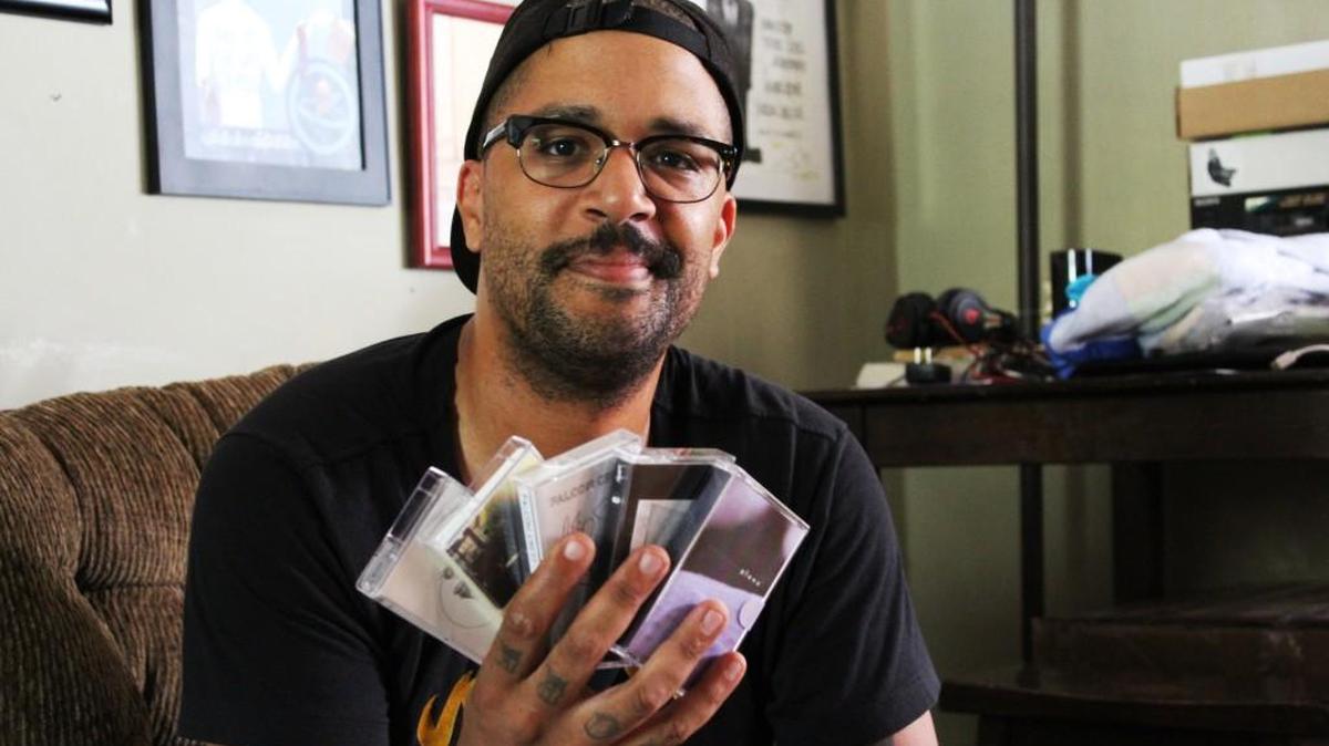 Dan Davis, 33, with a few recent cassette-tape releases from This Ain’t Heaven Recording Concern.