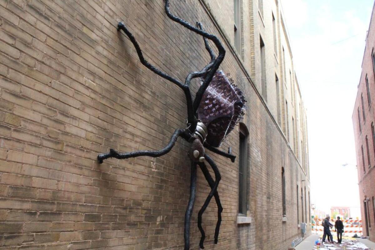 Mike Miller’s sculpture of a giant spider is the defining feature in Gallery Alley.