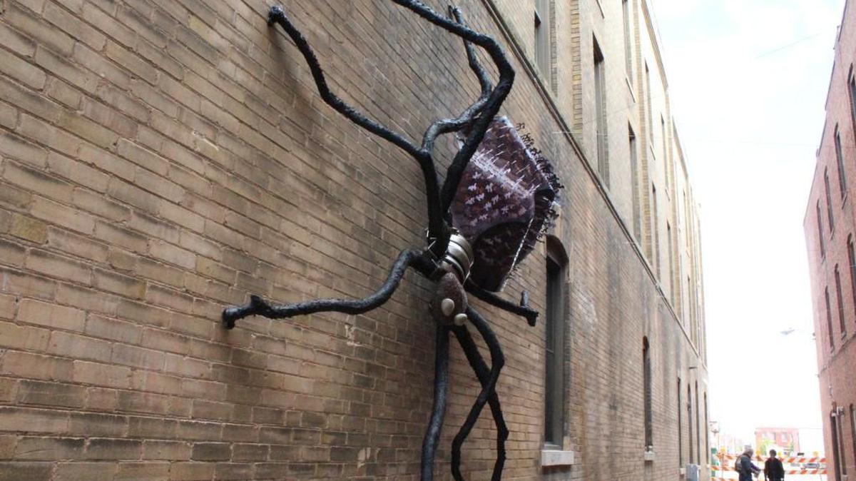 Mike Miller’s sculpture of a giant spider is the defining feature in Gallery Alley.