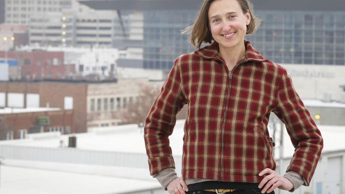 Elizabeth Stevenson, a local artist, architecture consultant and director of the Fisch Haus in Wichita’s Commerce Street Art District, stands on the roof of her home and business on South Commerce.