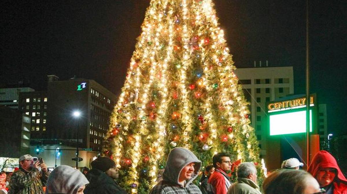 People gather around the city of Wichita’s Christmas tree, outside Century II. The Mayor’s Tree Lighting will be held Sunday.